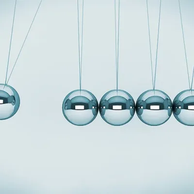 Spheres of Newton Perpetual motion concept. Spheres of Newton on a white background